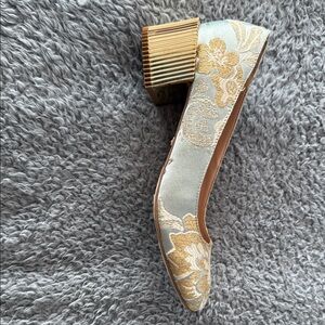 Kensie ladies shoe with brocade fabric and 2”gold heel.